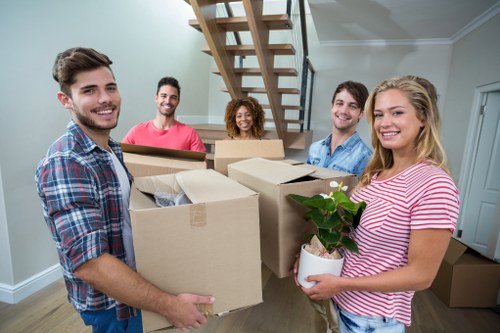 Packed boxes and moving equipment prepared for removals near Clapham Junction