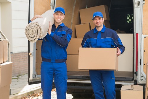 Packed moving boxes and furniture ready for transport