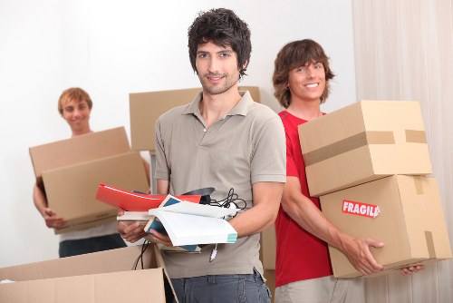 Removal van and moving team near Clapham Junction streets