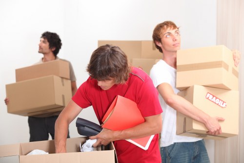 Packed office furniture and equipment ready for local relocation