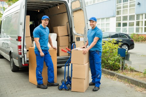Man with a van transporting boxes in a residential street