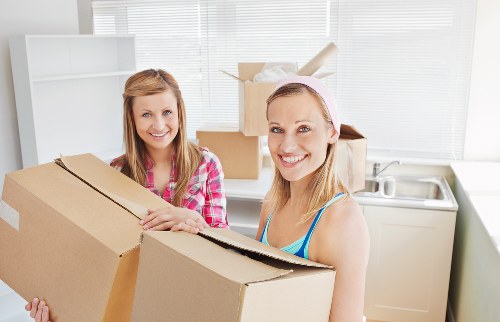 Moving crew loading furniture with care on a residential street