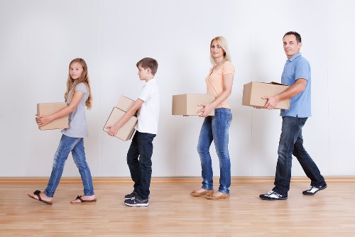 Packed boxes and furniture prepared for removal truck hire